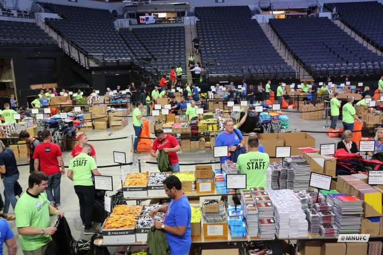 Successful Action Day 18 packing backpacks for kids in need -