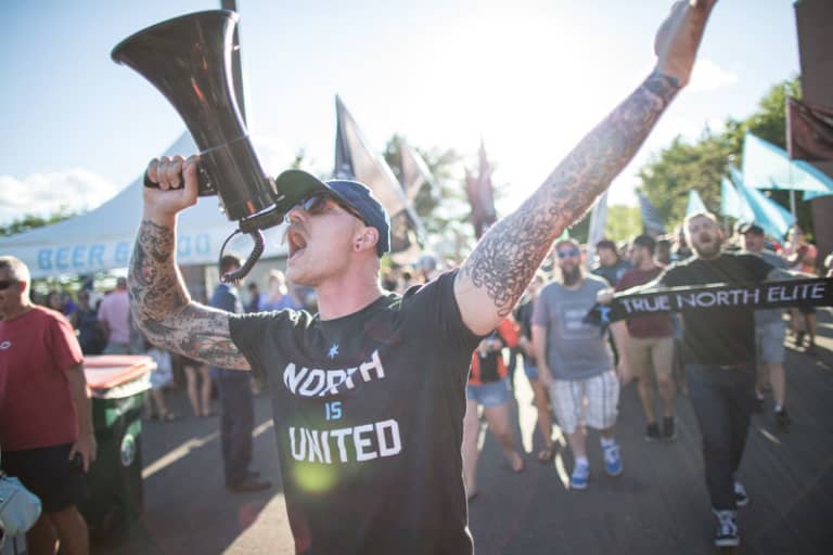 MLS made in Minnesota: Past, present & future of soccer in the Twin Cities - MNUFC supporter yells into a megaphone.