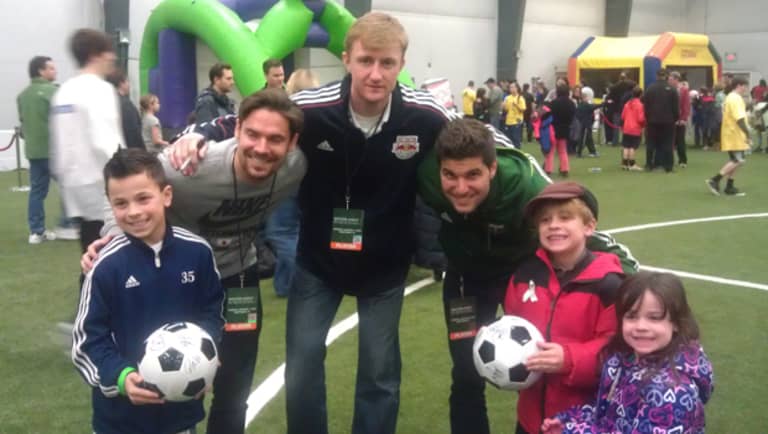 MLS community helps healing as 1,500 turn up for "Soccer Night in Newtown" -