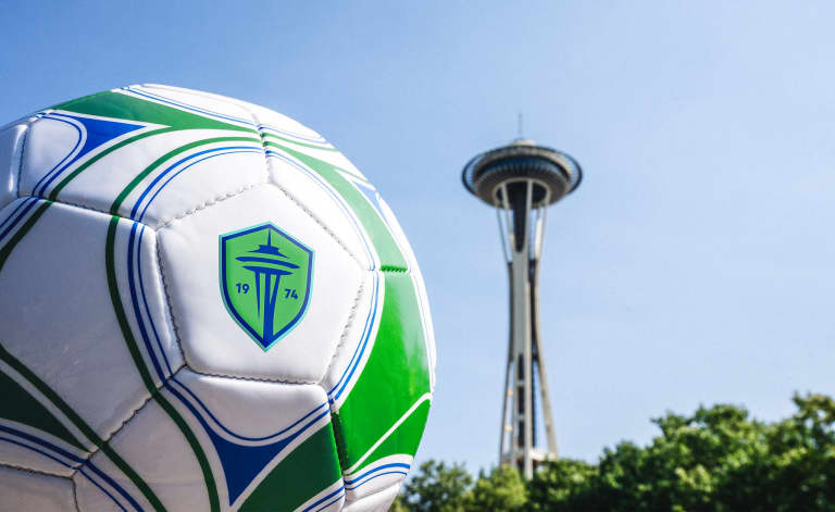 Our new crest on a RAVE soccer ball in front of the Space Needle