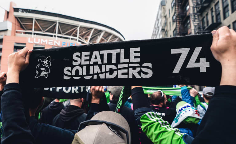 Our new Orca, Wordmark and 74 Mark on a scarf during the March to the Match to Lumen Field
