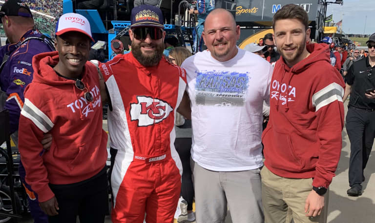 Gerso Fernandes and Ilie Sanchez attend Hollywood Casino 400 at Kansas Speedway -