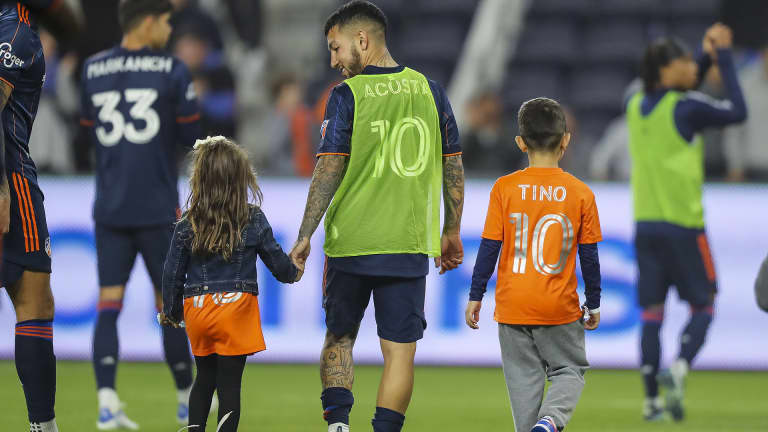 Luciano Acosta with his children