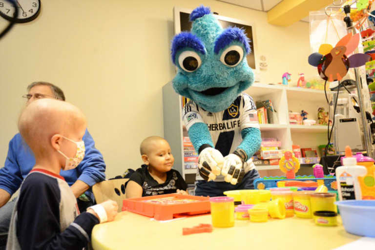 MLS W.O.R.K.S. LA Galaxy Foundation visit Children's Hospital LA with Cozmo and the MLS Cup trophy -