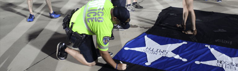FC Dallas supporters honor fallen police officers during match vs. Chicago - https://league-mp7static.mlsdigital.net/styles/full_landscape/s3/images/Frisco-PD-signing-FCD-tribute-tifo.png