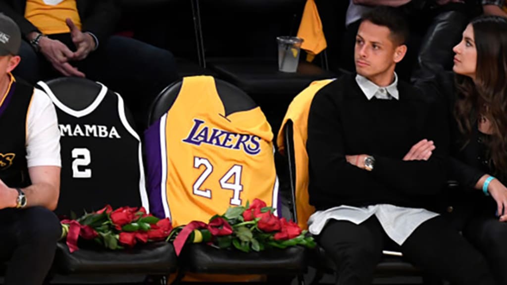 Chicharito Hernandez sits courtside next to seats left for Kobe