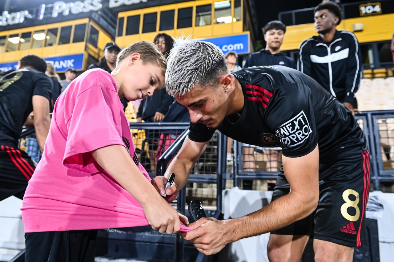 Atlanta United 2 midfielder Nick Firmino #8 signs autograph for a fan after the MLS Next Pro match against New York City FC 2 at Fifth-Third Bank Stadium in Marietta, Ga. on Sunday, June 25, 2023. (Photo by Asher Greene/Atlanta United)