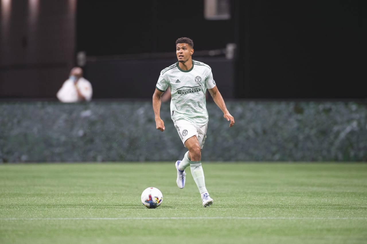Atlanta United defender Miles Robinson #12 dribbles the ball during the match against Chicago Fire FC at Mercedes-Benz Stadium in Atlanta, United States on Saturday May 7, 2022. (Photo by Kyle Hess/Atlanta United)