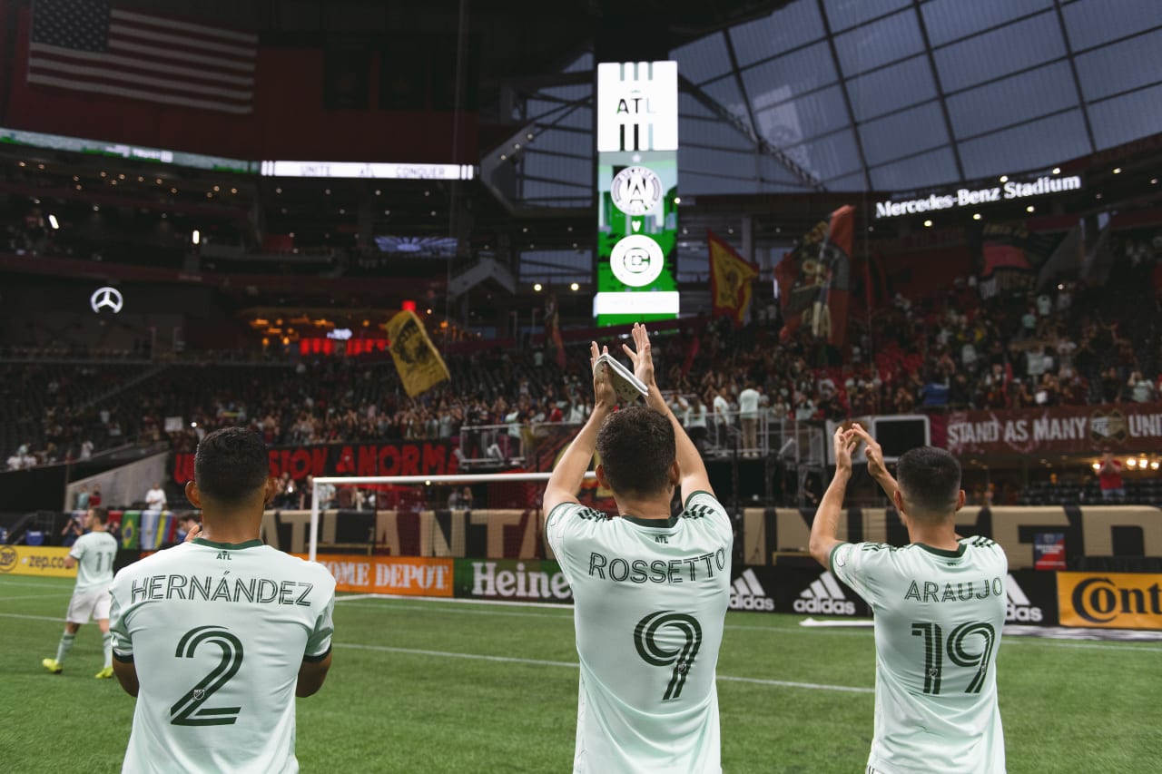 Atlanta United defender Ronald Hernandez #2, midfielder Matheus Rossetto #9 and forward Luiz Araújo #19 interact with supporters after the match against Chicago Fire FC at Mercedes-Benz Stadium in Atlanta, United States on Saturday May 7, 2022. (Photo by Brandon Magnus/Atlanta United)