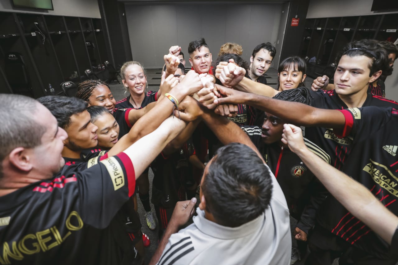 Players huddle and cheer before the Unified match against Orlando City SC at Mercedes-Benz Stadium in Atlanta, Georgia, on Sunday July 17, 2022. (Photo by AJ Reynolds/Atlanta United)
