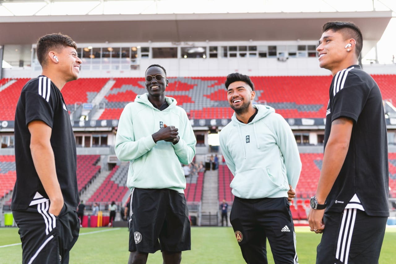 Atlanta United players laugh on the pitch before the match against Toronto FC at BMO Field in Toronto, Canada on Saturday June 25, 2022. (Photo by Dakota Williams/Atlanta United)
