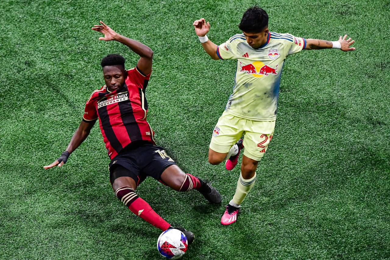 Atlanta United midfielder Derrick Etienne Jr. #18 slides for a tackle during the first half during the match against New York Red Bulls at Mercedes-Benz Stadium in Atlanta, GA on Saturday, April 1, 2023. (Photo by Kyle Hess/Atlanta United)