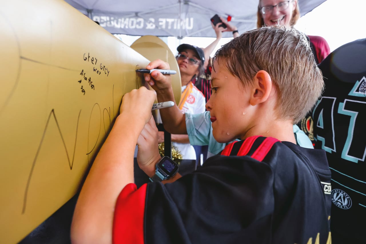 Fans sign the golden spike prior to the match against Toronto FC at Mercedes-Benz Stadium in Atlanta, United States on Saturday September 10, 2022. (Photo by Casey Sykes/Atlanta United)
