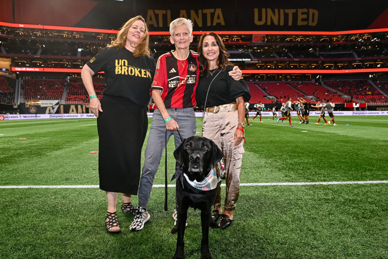 Honorary Captain Command Sergeant Major Gretchen Evans and her Vetdog, Rusty prior to the match against Columbus Crew at Mercedes-Benz Stadium in Atlanta, GA on Saturday, October 7, 2023. (Photo by Brandon Magnus/Atlanta United)