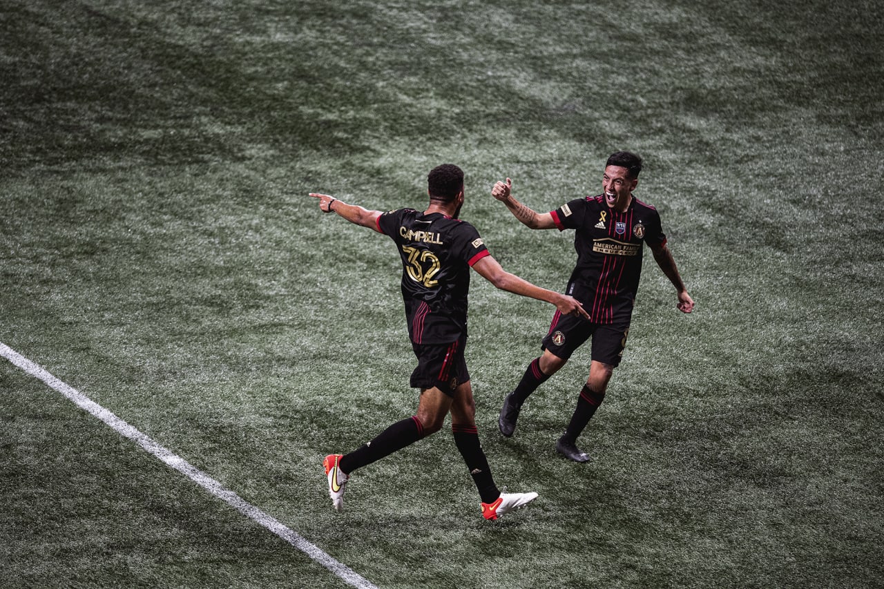 Atlanta United defender George Campbell #32 celebrates with midfielder Ezequiel Barco #8 after scoring the first goal of the match against Orlando City at Mercedes-Benz Stadium in Atlanta, Georgia on Friday September 10, 2021. (Photo by Adam Hagy/Atlanta United)