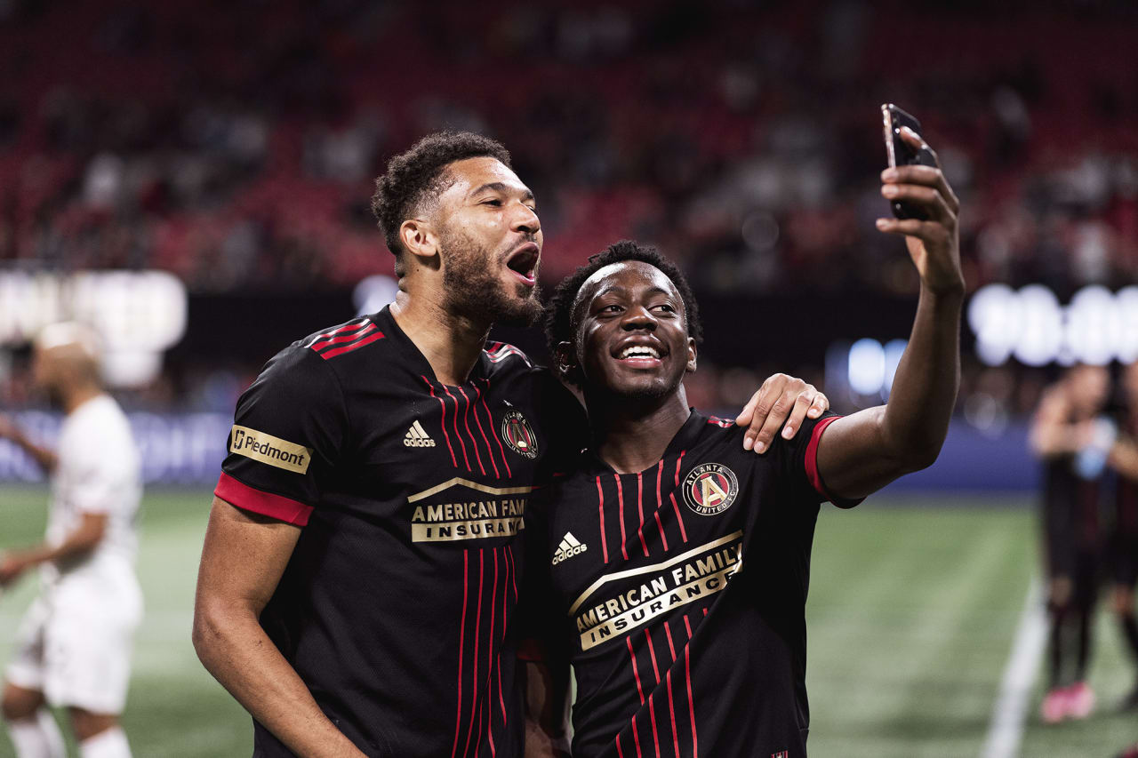 Atlanta United defender George Campbell #32 celebrates with defender George Bello #21 after the match against Inter Miami at Mercedes-Benz Stadium in Atlanta, Georgia on Wednesday October 27, 2021. (Photo by Jacob Gonzalez/Atlanta United)