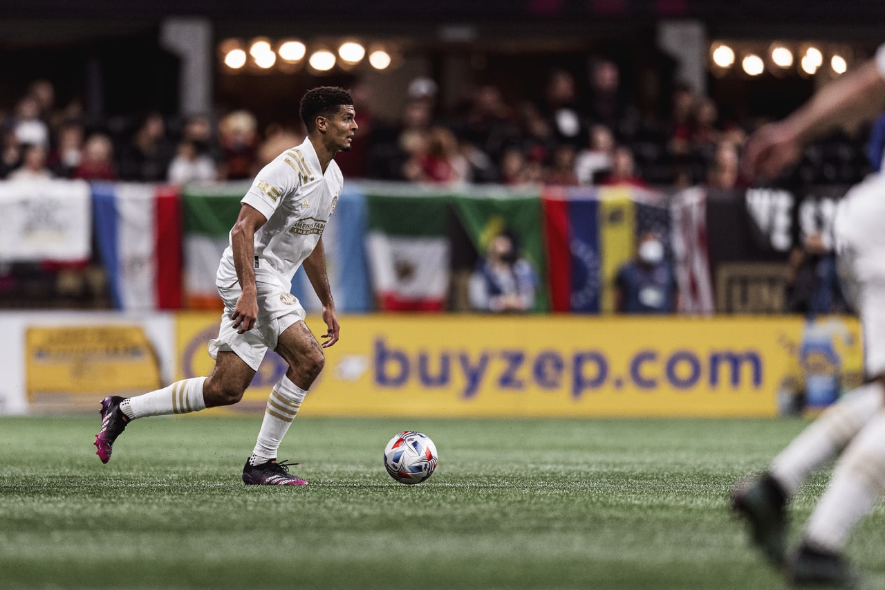 Atlanta United defender Miles Robinson #12 dribbles the ball during the match against New York City FC at Mercedes-Benz Stadium in Atlanta, Georgia on Wednesday October 20, 2021. (Photo by Jacob Gonzalez/Atlanta United)