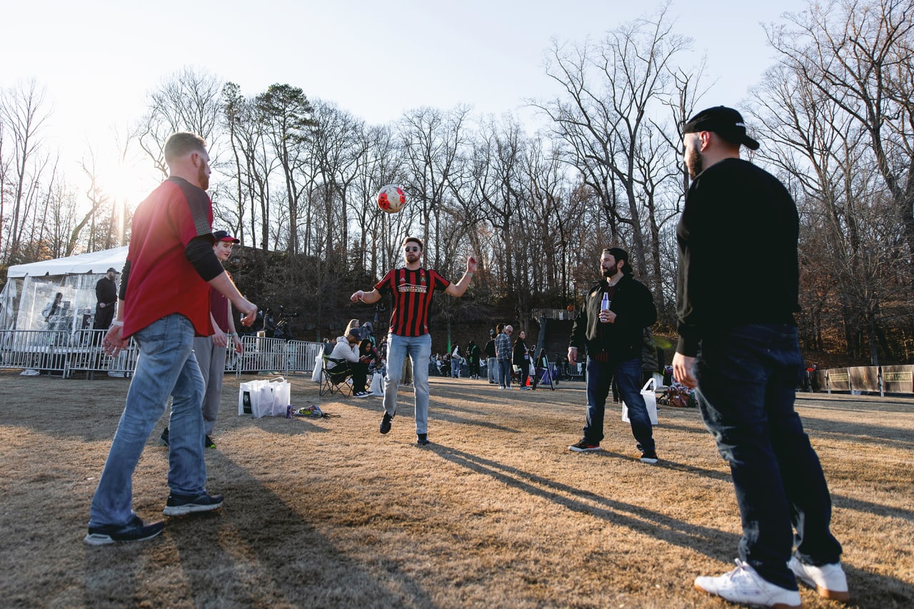 Atlanta United supporters pass a ball during the 2022 Atlanta United Kit Launch at Piedmont Park in Atlanta, United States on Saturday February 19, 2022. (Photo by Dakota Williams/Atlanta United)