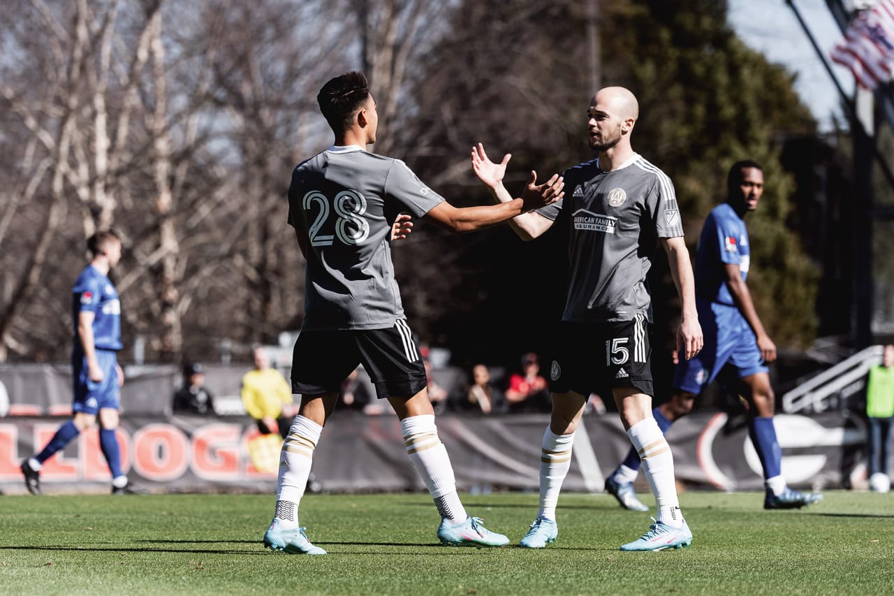 Atlanta United forward Tyler Wolff #28 celebrates with defender Andrew Gutman #15 after scoring a goal during the first half of the preseason match against the Georgia Revolution at Turner Soccer Complex in Athens, Georgia, on Sunday January 30, 2022. (Photo by Jacob Gonzalez/Atlanta United)