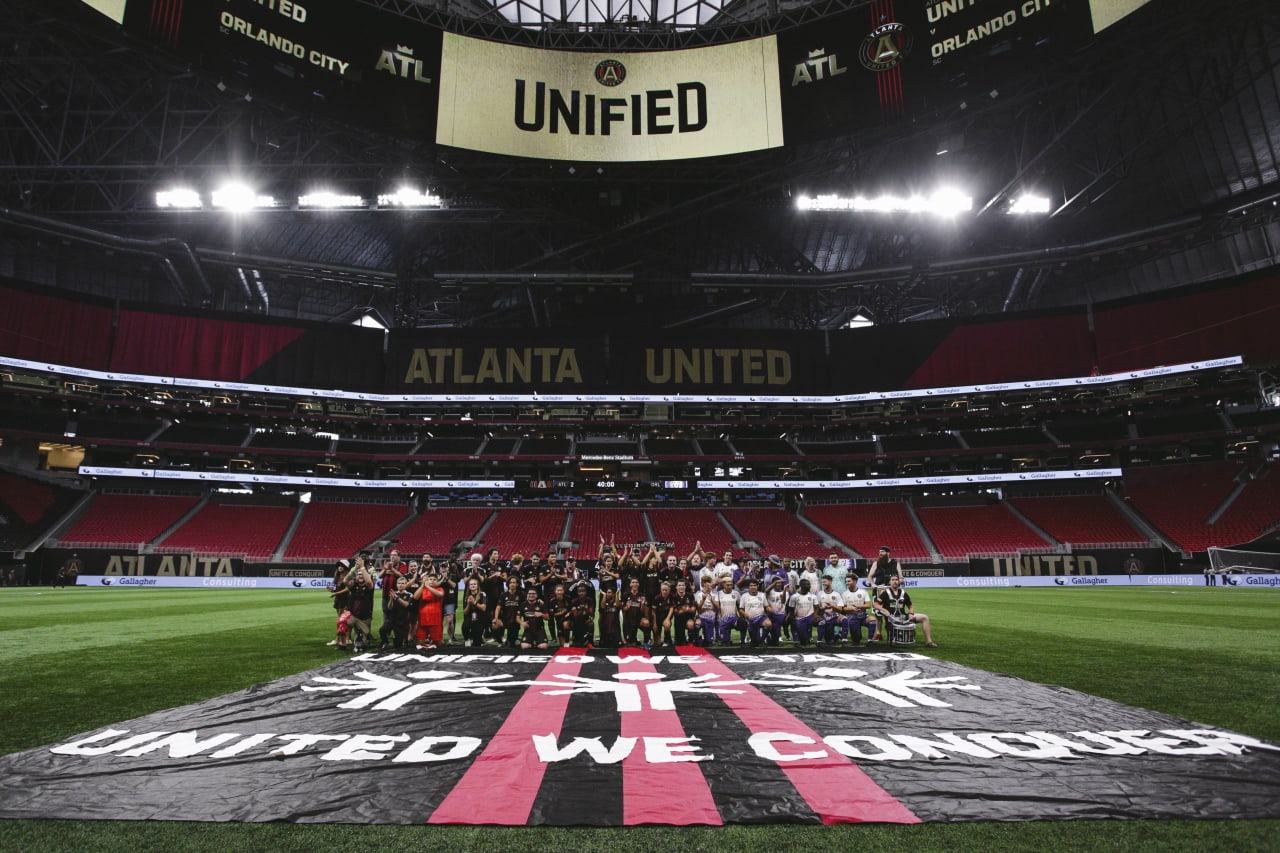 Players celebrate after the Unified match against Orlando City SC at Mercedes-Benz Stadium in Atlanta, Georgia, on Sunday July 17, 2022. (Photo by Matthew Grimes/Atlanta United)