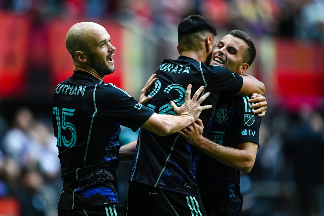Atlanta United defender Juan José Sanchez Purata #22 celebrates with defender Brooks Lennon #11 and defender Andrew Gutman #15 after scoring the game-winning goal during the second half of the match against Chicago Fire FC at Mercedes-Benz Stadium in Atlanta, GA on Sunday, April 23, 2023. (Photo by Brandon Magnus/Atlanta United)
