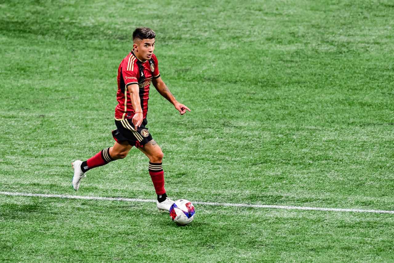 Atlanta United midfielder Thiago Almada #23 dribbles during the first half of the match against New England Revolution at Mercedes-Benz Stadium in Atlanta, GA on Wednesday, May 31, 2023. (Photo by Kyle Hess/Atlanta United)
