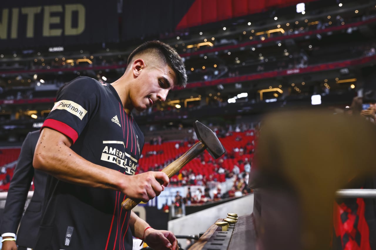 Atlanta United midfielder Thiago Almada #8 is awarded the golden spike after the match against New England Revolution at Mercedes-Benz Stadium in Atlanta, United States on Sunday May 15, 2022. (Photo by Casey Sykes/Atlanta United)