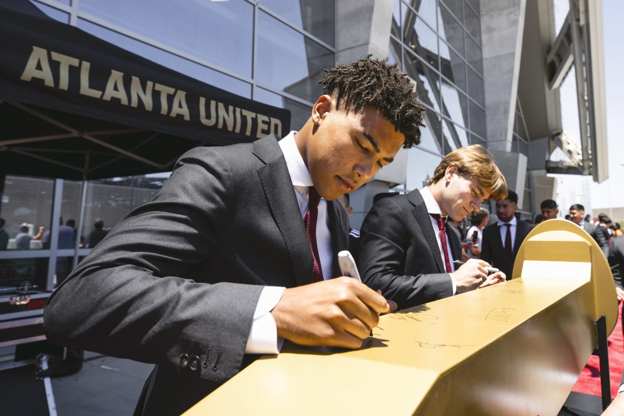Atlanta United defender Caleb Wiley #26 signs the spike before the match against  at  in , United States on Sunday June 19, 2022. (Photo by Karl Moore/Atlanta United)