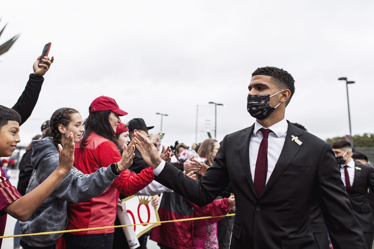 Atlanta United defender Miles Robinson #12 interacts with supporters before the match against Toronto FC at Mercedes-Benz Stadium in Atlanta, Georgia on Saturday October 30, 2021. (Photo by Jacob Gonzalez/Atlanta United)