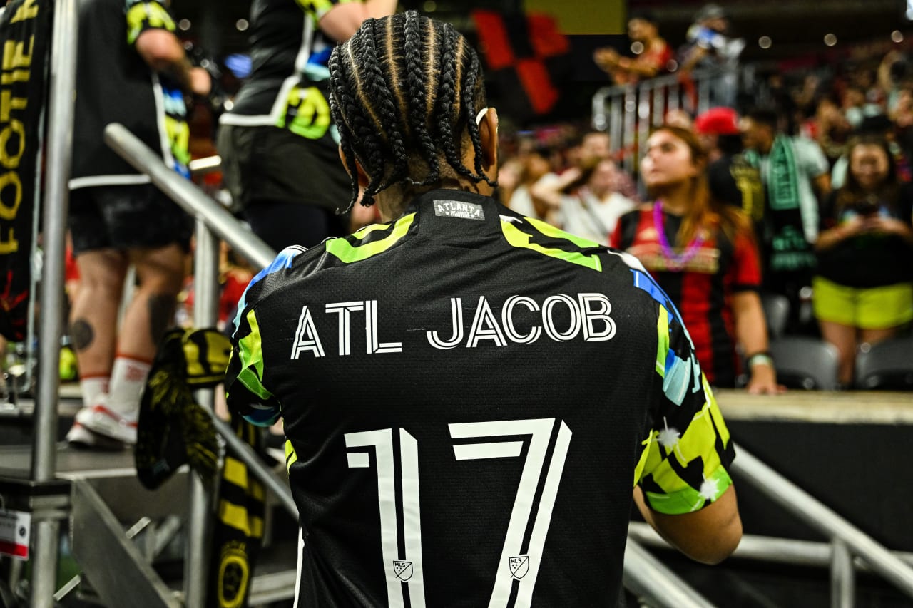 Supporters stand after the victory against CF Montreal at Mercedes-Benz Stadium in Atlanta, GA on Saturday, September 23, 2023. (Photo by Scoot/Atlanta United)