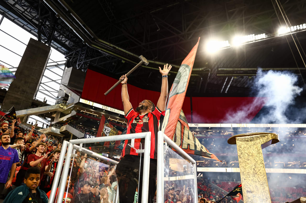 Spike hitter Terrence Lester waves to the crowd after hitting the golden spike before the match against New York City FC at Mercedes-Benz Stadium in Atlanta, GA on Wednesday, June 21, 2023. (Photo by Bee Trofort-Wilson/Atlanta United)