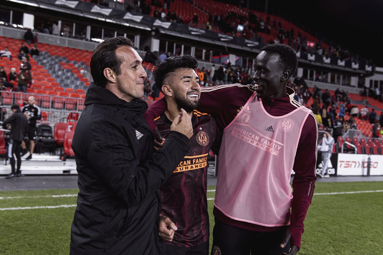 Atlanta United midfielder Marcelino Moreno #10 celebrates with forward Machop Chol #30 and Assistant Coach Diego De La Torre after the match against Toronto FC at BMO Training Ground in Toronto, Ontario on Saturday October 16, 2021. (Photo by Jacob Gonzalez/Atlanta United)
