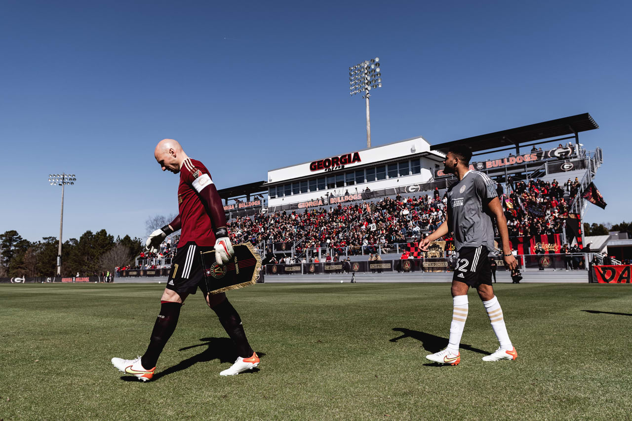 Atlanta United goalkeeper Brad Guzan #1 and defender George Campbell #32 walk out onto the pitch before the preseason match against the Georgia Revolution at Turner Soccer Complex in Athens, Georgia, on Sunday January 30, 2022. (Photo by Jacob Gonzalez/Atlanta United)