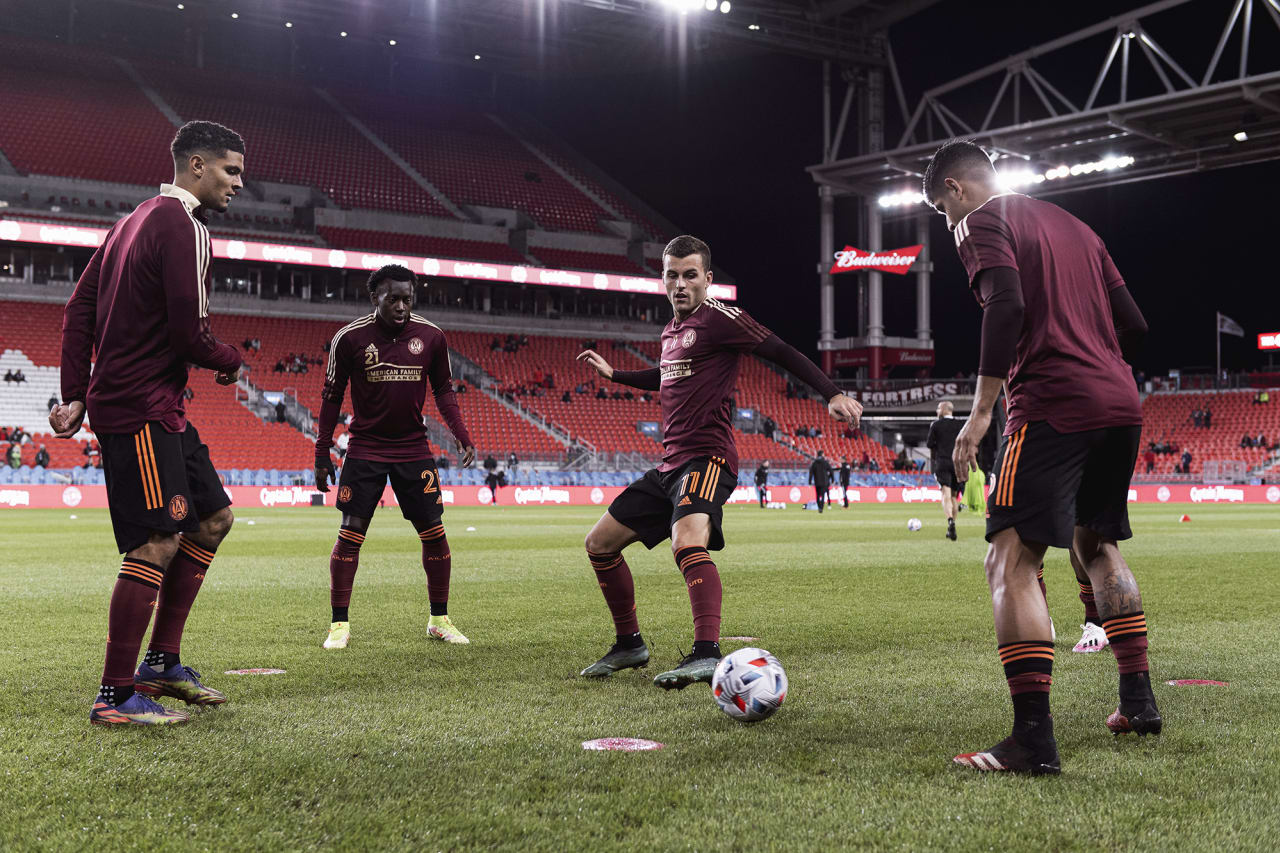 Atlanta United defender Miles Robinson #12, defender George Bello #21, defender Brooks Lennon #11 and defender Alan Franco #6 warm up before the match against Toronto FC at BMO Training Ground in Toronto, Ontario on Saturday October 16, 2021. (Photo by Jacob Gonzalez/Atlanta United)