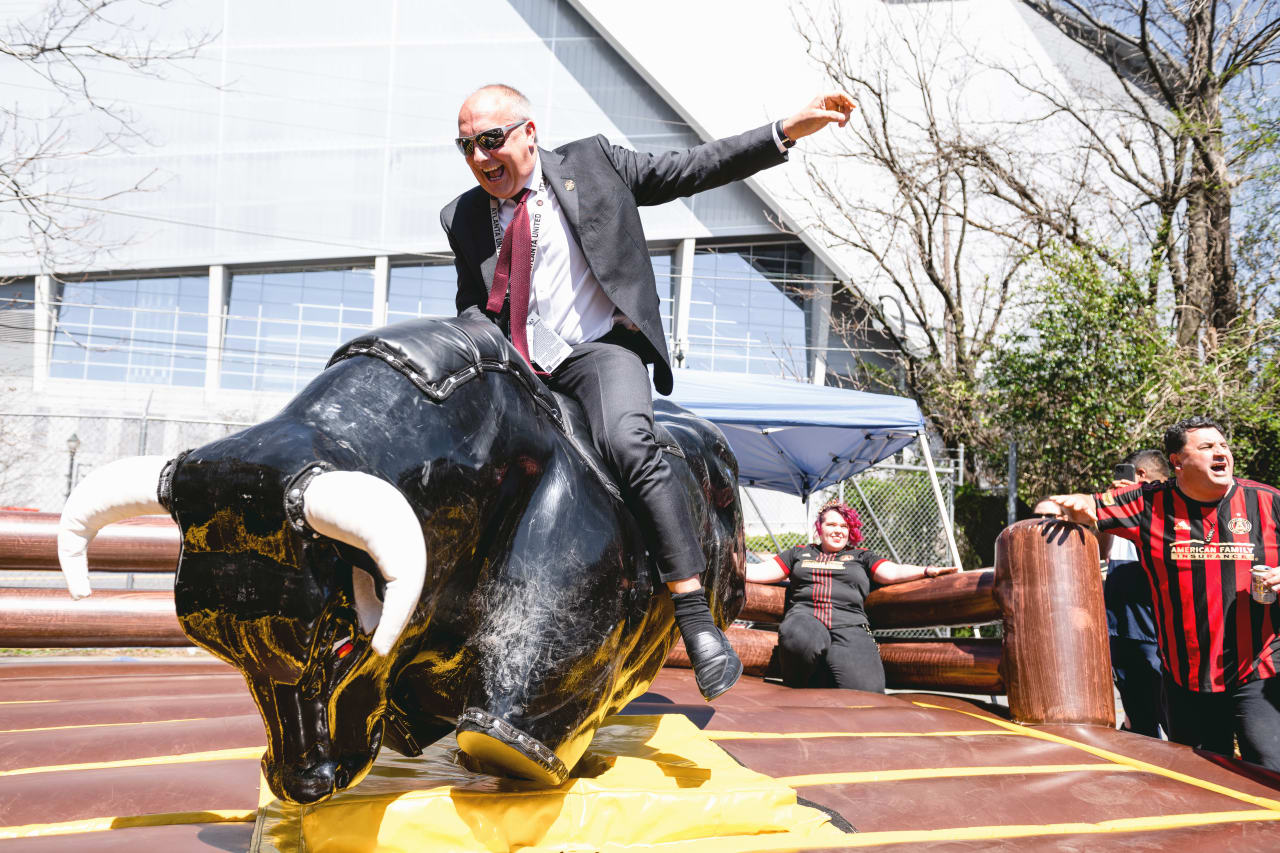 Darren Eales rides a bull at the Home Depot Backyard before the match against CF Montreal at Mercedes-Benz Stadium in Atlanta, United States on Saturday March 19, 2022. (Photo by Adam Hagy/Atlanta United)