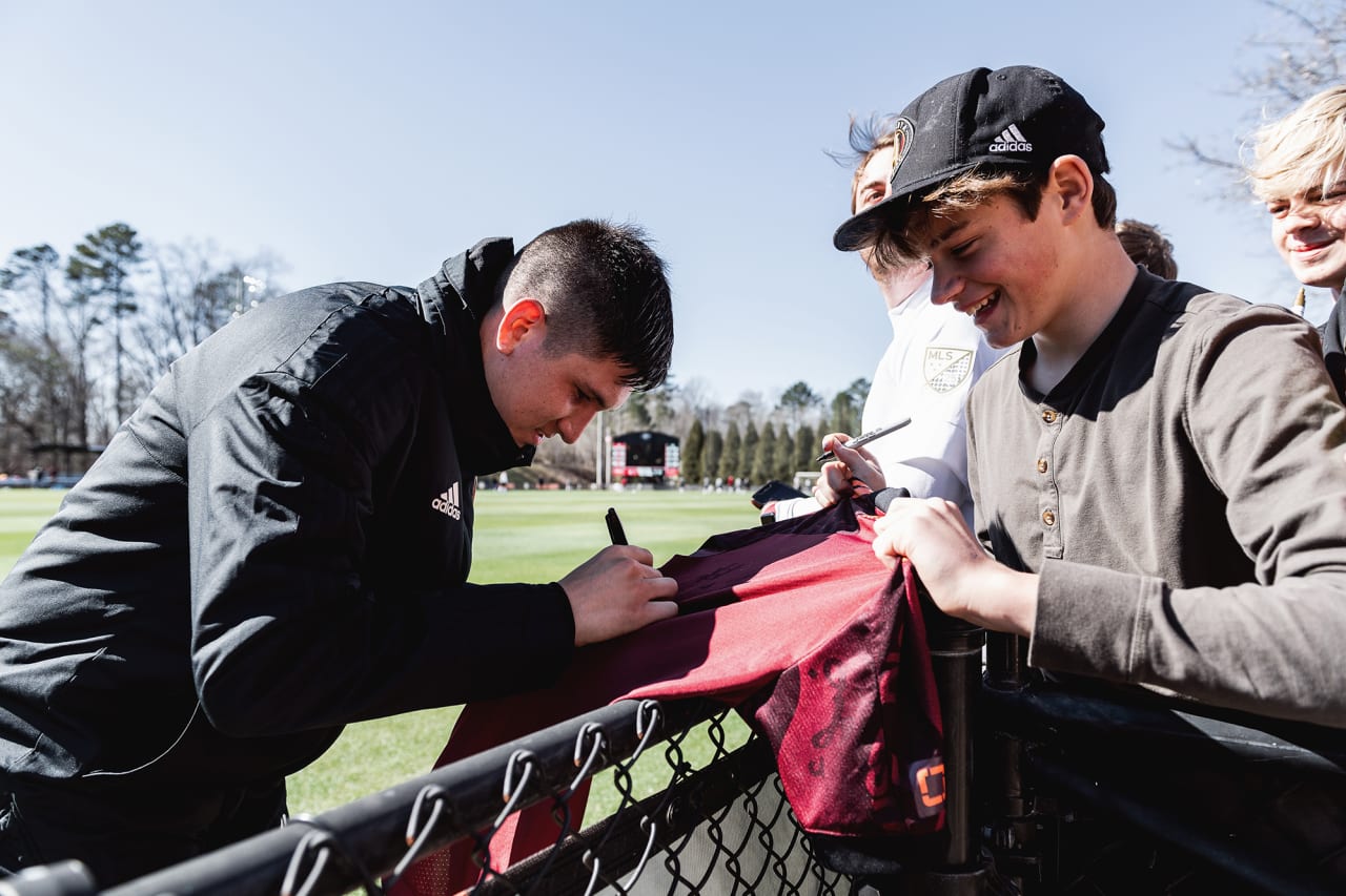 Atlanta United midfielder Franco Ibarra #14 signs autographs for supporters during the preseason match against the Georgia Revolution at Turner Soccer Complex in Athens, Georgia, on Sunday January 30, 2022. (Photo by Jacob Gonzalez/Atlanta United)