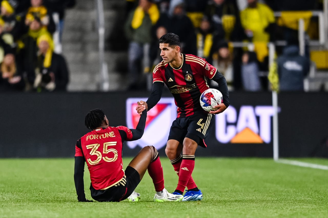 Atlanta United defender Luis Abram #4 helps up defender Ajani Fortune #35 during the first half of the match against Columbus Crew at Lower.com Field in Columbus, OH on Wednesday, November 1, 2023. (Photo by Jay Bendlin/Atlanta United)