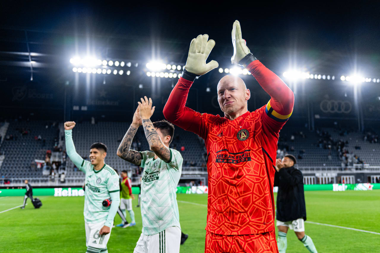 Atlanta United goalkeeper Brad Guzan #1, midfielder Franco Ibarra #14 and defender Alan Franco #6 thank the traveling supporters after the match against DC United at Audi Field in Washington, DC, on Saturday April 2, 2022. (Photo by Mitch Martin/Atlanta United)
