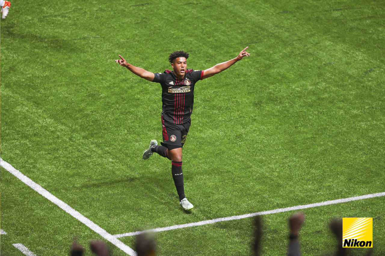 Atlanta United defender Caleb Wiley #26 celebrates after scoring a goal during the 2022 Opening Day match against Sporting Kansas City at Mercedes-Benz Stadium in Atlanta, United States on Sunday February 27, 2022. (Photo by Matthew Grimes/Atlanta United)