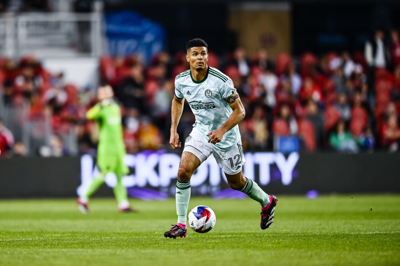 Atlanta United defender Miles Robinson #12 dribbles the ball during the match against Toronto FC at BMO Field in Toronto, Canada on Saturday, April 15, 2023. (Photo by Brandon Magnus/Atlanta United)