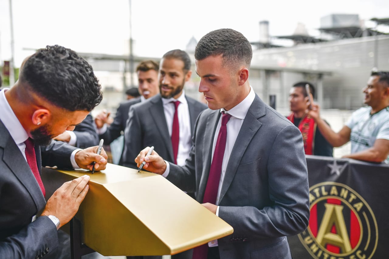 Atlanta United defender Brooks Lennon #11 and forward Dom Dwyer #4 sign the golden spike before the match against New York Red Bulls at Mercedes-Benz Stadium in Atlanta, United States on Wednesday August 17, 2022. (Photo by Kyle Hess/Atlanta United)