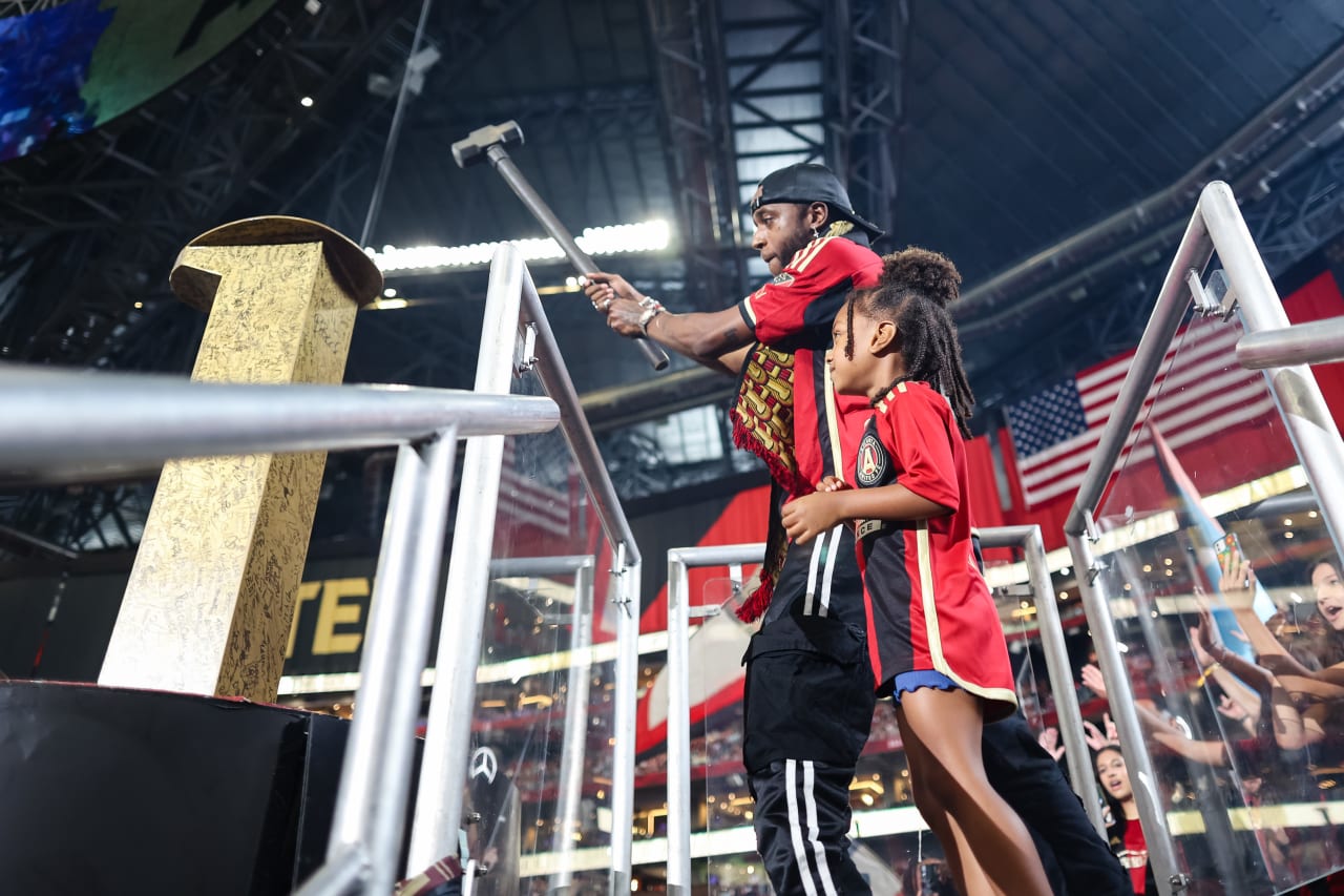 6lack hits the golden spike during the match against Orlando City at Mercedes-Benz Stadium in Atlanta, GA on Saturday, July 15, 2023. (Photo by Chamberlain Smith/Atlanta United)