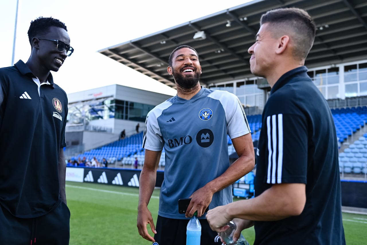 Atlanta United forward Machop Chol #30 and midfielder Matheus Rossetto #20 talk with former Atlanta United player George Campbell before the match against CF Montreal at Stade Saputo in Montreal, Canada on Saturday, July 8, 2023. (Photo by Mitchell Martin/Atlanta United)