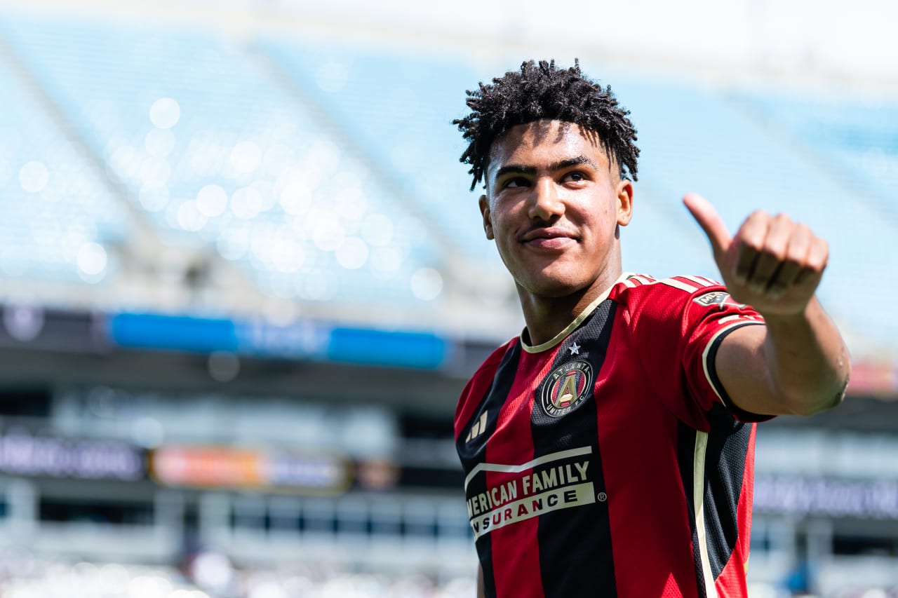 Atlanta United defender Caleb Wiley #26 smiles towards supporters during the match against Charlotte FC at Bank of America Stadium in Charlotte, North Carolina on Saturday, March11, 2023. (Photo by Mitch Martin/Atlanta United)