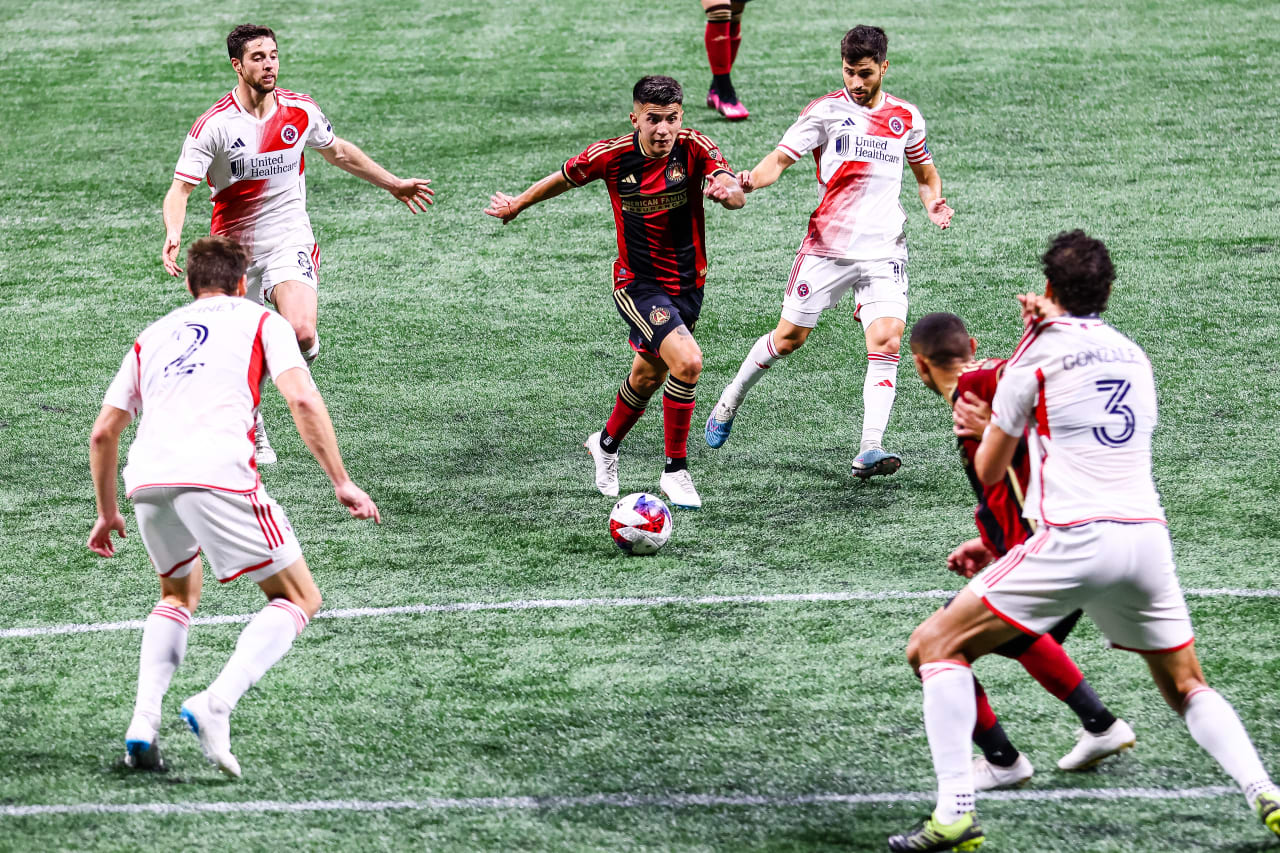 Atlanta United midfielder Thiago Almada #23 dribbles during the second half of the match against New England Revolution at Mercedes-Benz Stadium in Atlanta, GA on Wednesday, May 31, 2023. (Photo by Casey Sykes/Atlanta United)