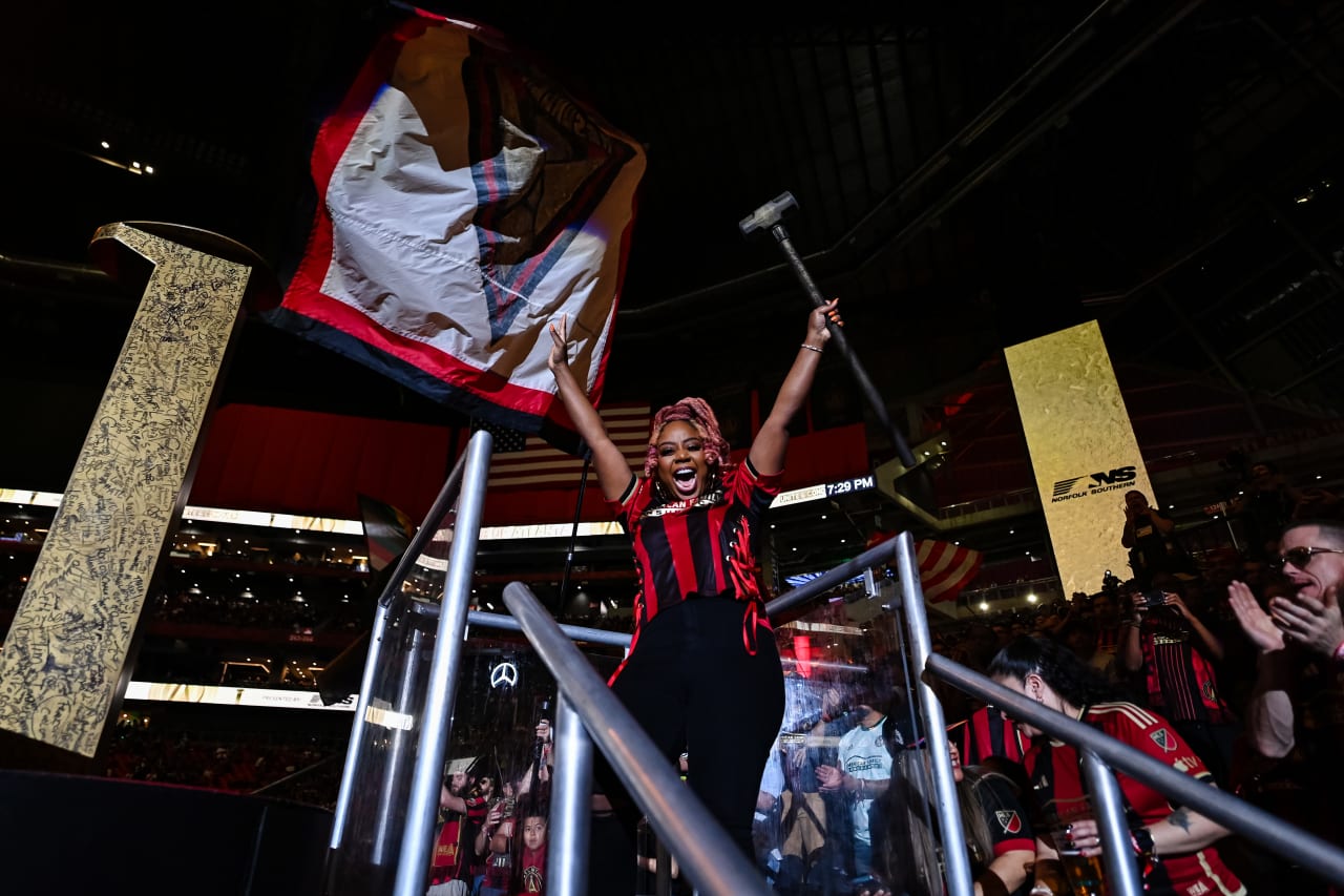 Owner of the Slutty Vegan Pinky Cole hits the golden spike before the match against Toronto FC at Mercedes-Benz Stadium in Atlanta, GA on Saturday March 4, 2023. (Photo by Jay Bendlin/Atlanta United)