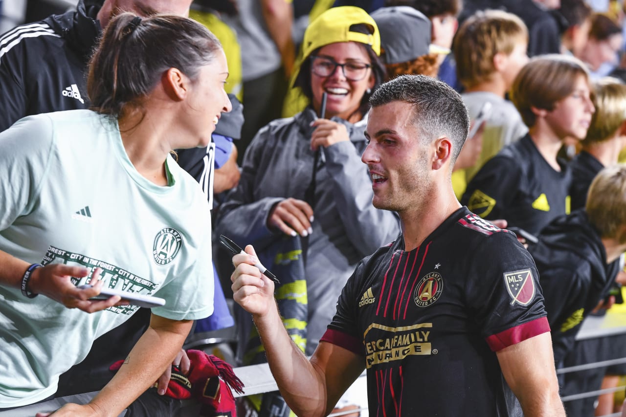 Atlanta United defender Brooks Lennon #11 interacts with supporters after during match against Columbus Crew at Lower.com Field in Columbus, United States on Sunday August 21, 2022. (Photo by Ben Jackson/Atlanta United)