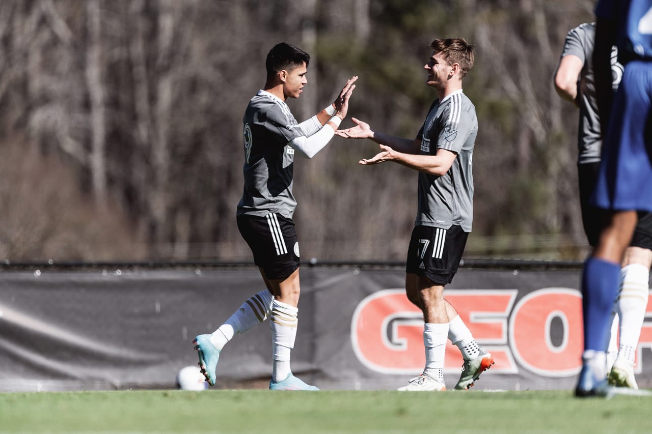 Atlanta United forward Luiz Araújo #19 celebrates with defender Aiden McFadden after scoring during the first half of the preseason match against the Georgia Revolution at Turner Soccer Complex in Athens, Georgia, on Sunday January 30, 2022. (Photo by Jacob Gonzalez/Atlanta United)