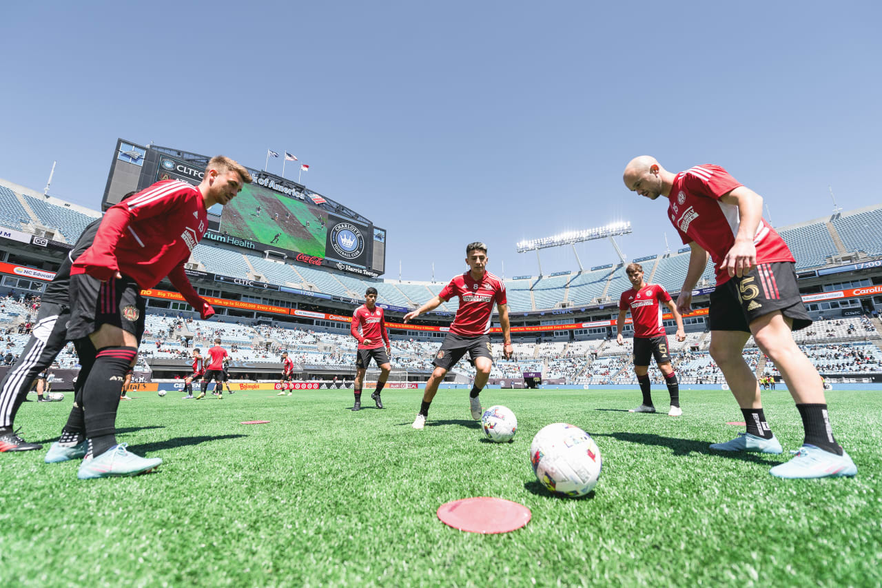 Atlanta United midfielder Thiago Almada #8 warms up midfielder Amar Sejdic #13 and defender Andrew Gutman #15 with before the match against Charlotte FC at Bank of America Stadium in Charlotte, United States on Sunday April 10, 2022. (Photo by Dakota Williams/Atlanta United)