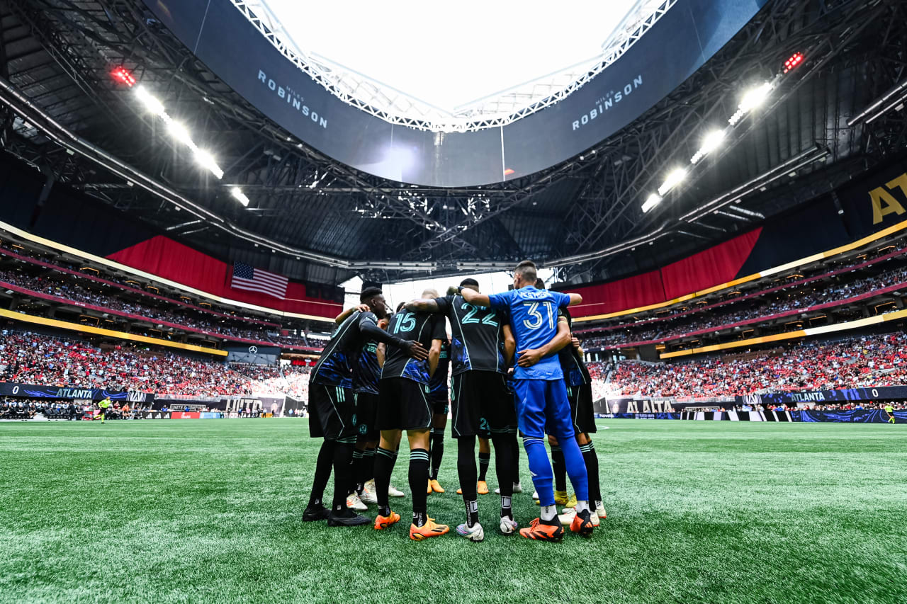 The Starting XI huddle before the match against Chicago Fire FC at Mercedes-Benz Stadium in Atlanta, GA on Sunday, April 23, 2023. (Photo by Mitchell Martin/Atlanta United)